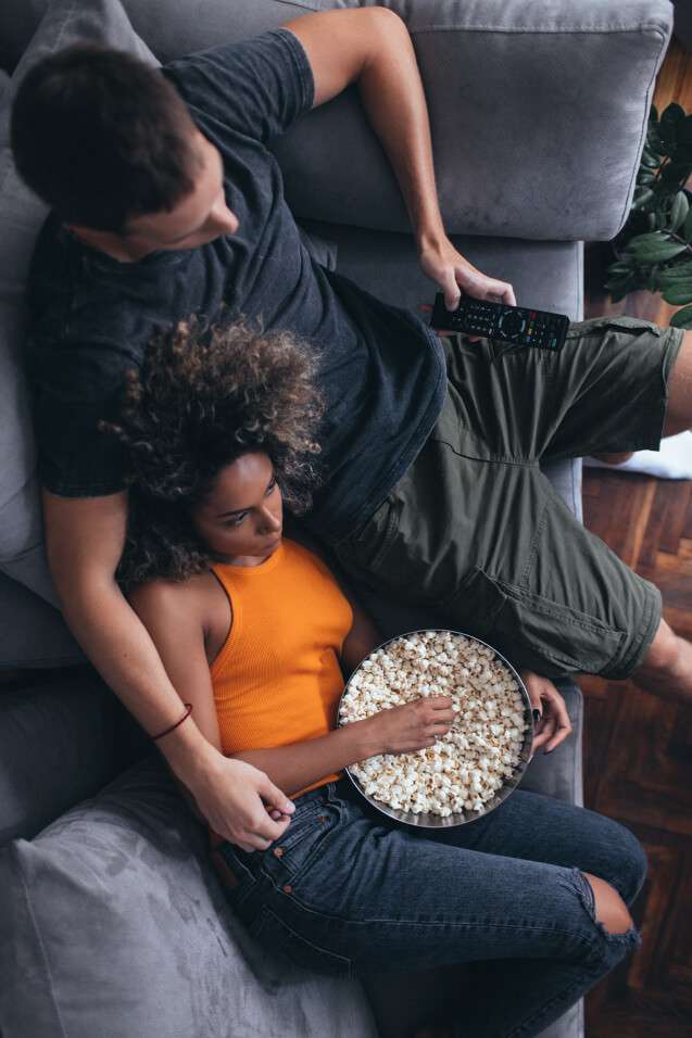 Couple watching TV from couch
