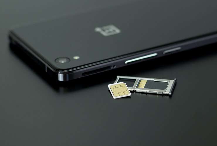 SIM cards next to a mobile phone