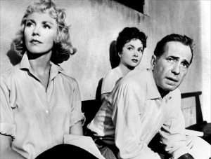 thre actors sitting on a bench
