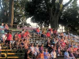 parents and spectators in the stadium bleachers