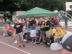 young mens basketball game outside