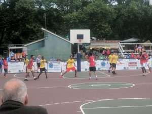 young mens basketball game outside