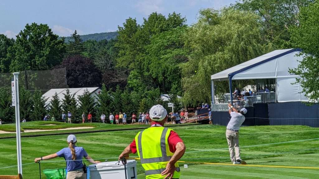 man hitting golf ball on golf course