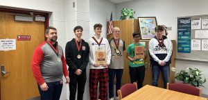 5 highscool boys team accepting awards