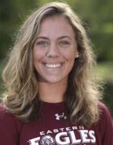 woman soccer player smiling for profile image while wearing a easter eagles tshirt