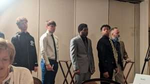 high school football students standing to accept awards at 2023 football scholar night