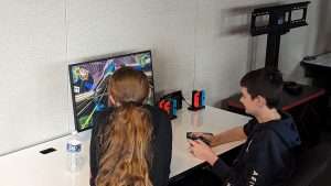 2 high school students competing in Mario Kart