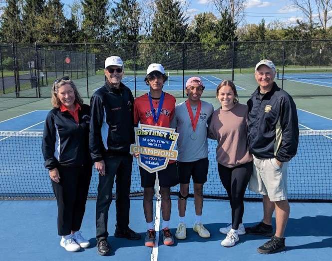 group photo of coaches with two winning tennis players at the 2A Boys tennis single's championship