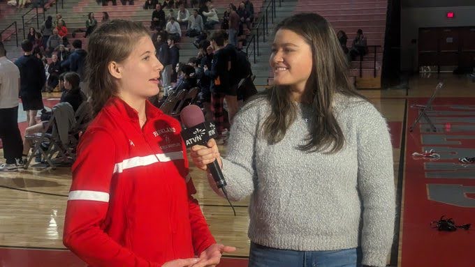ATVN broadcaster interviewing a high school women's wrestler