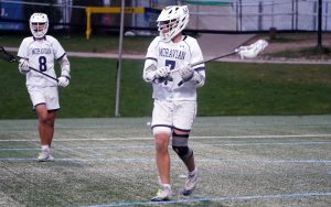 young man playing lacrosse