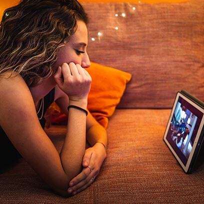 woman relaxing and watching video stream