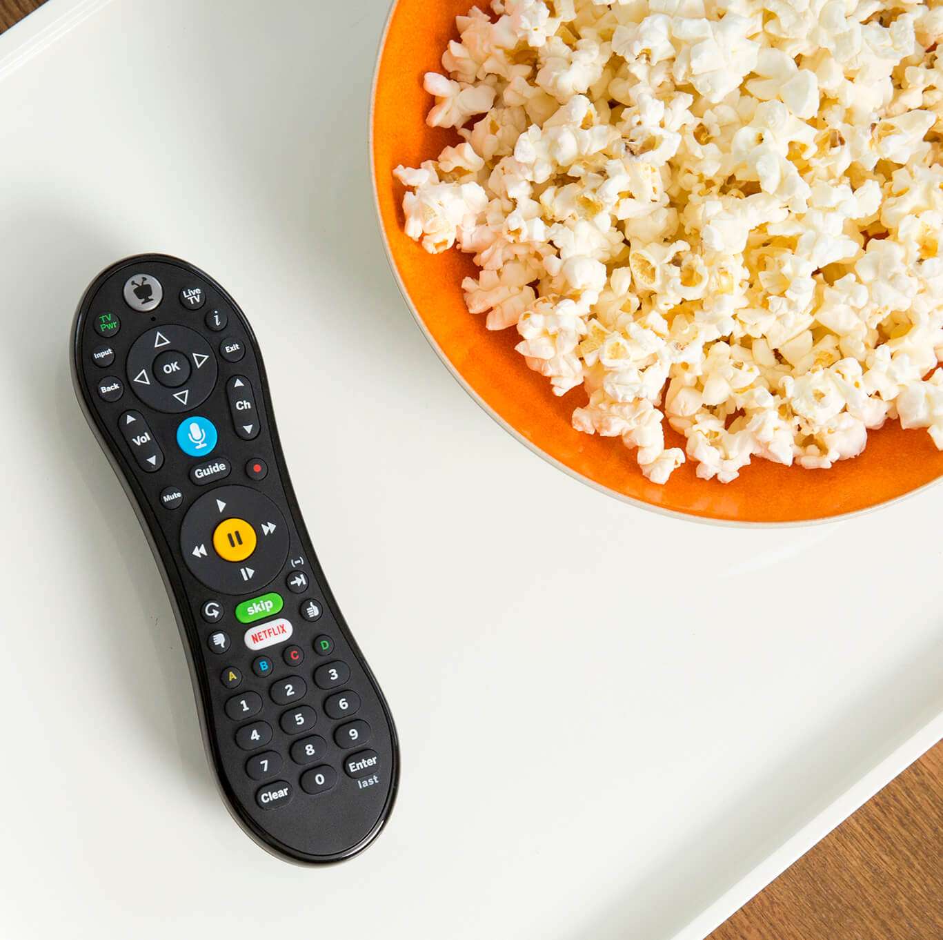 Remote and bowl of popcorn