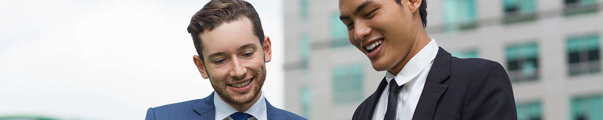 two business men talking together