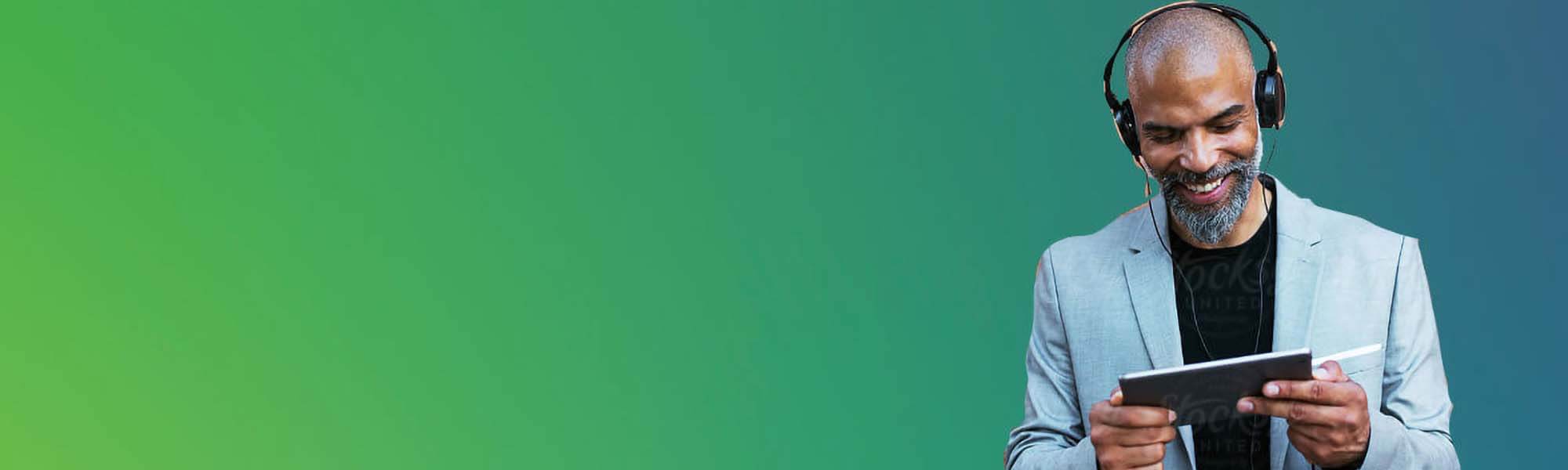 green background man with beard and headphones