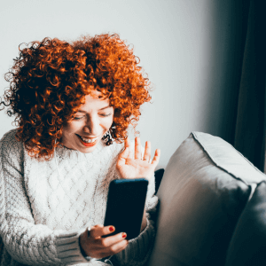 Woman using mobile phone to telecommunicate