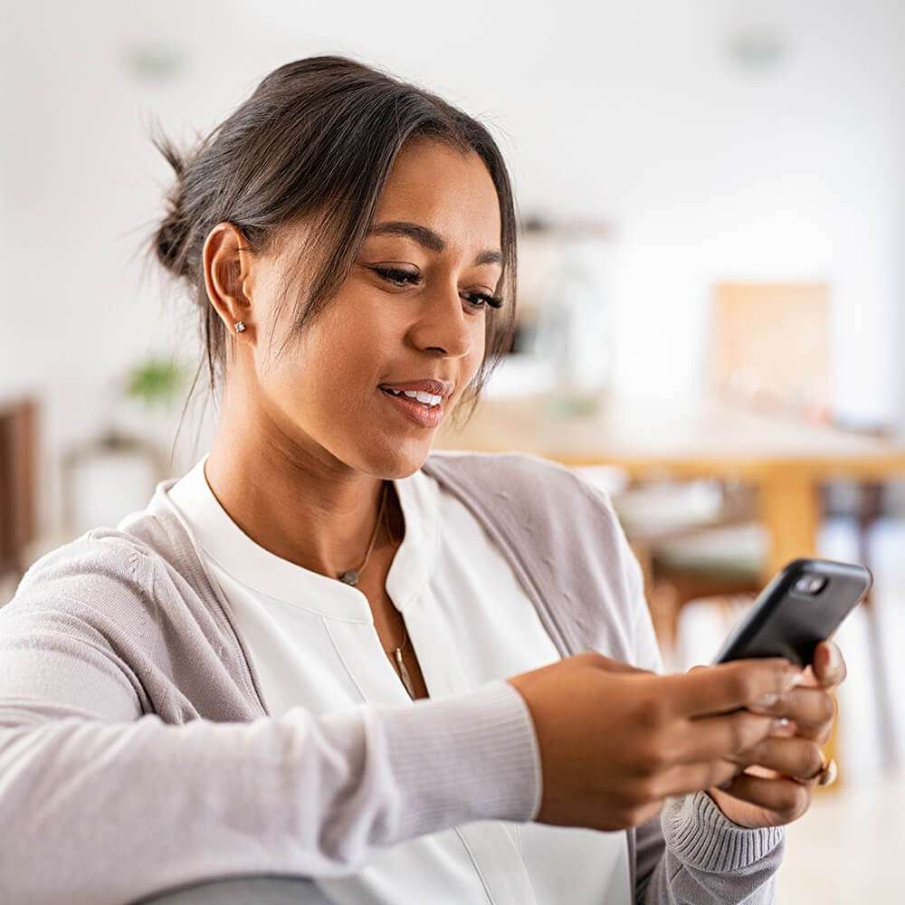 woman looking at cell phone