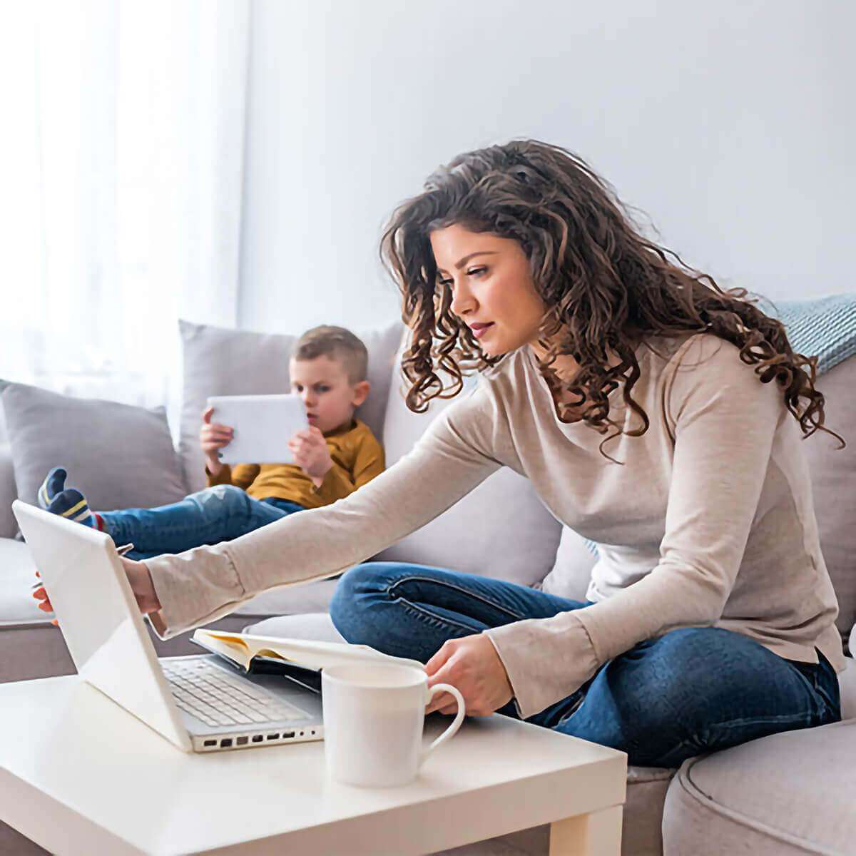 Family on couch with devices