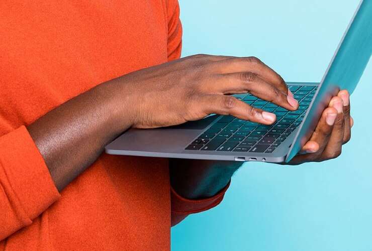 Hands on a laptop