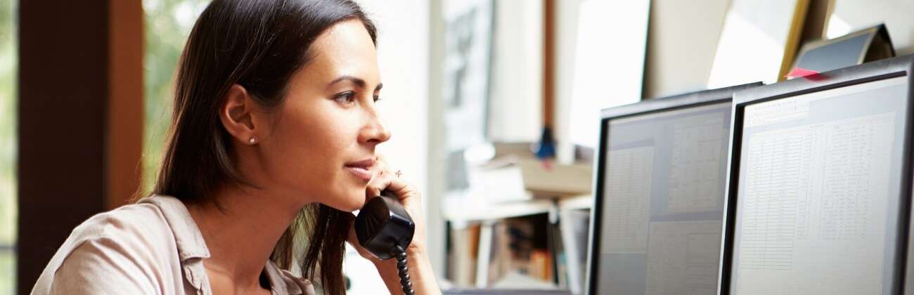 Woman listens to home phone messages