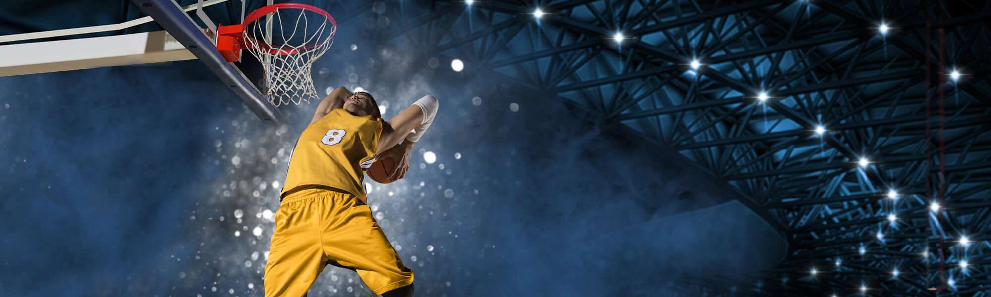 Dramatic angle on a college basketball slam dunk