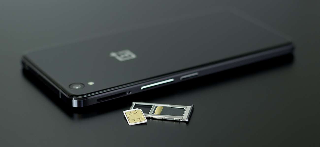 SIM cards displayed beside a mobile device