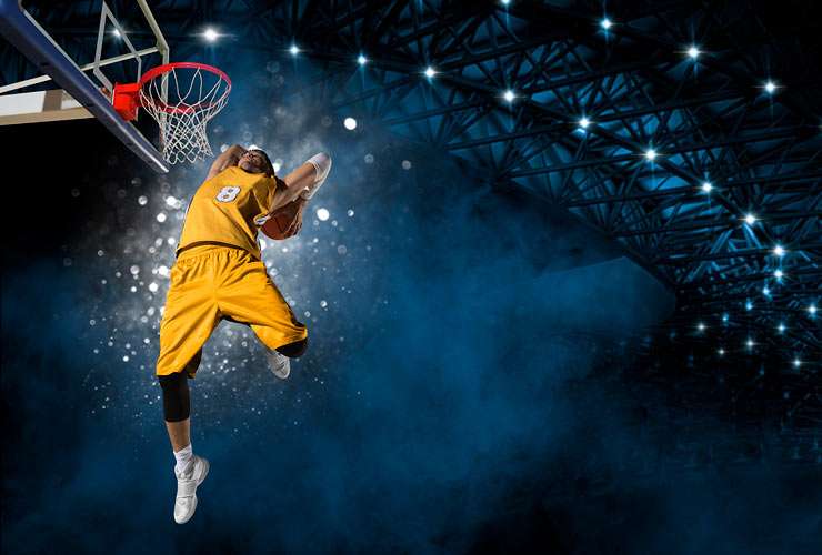 Dramatic angle on a college basketball slam dunk shot