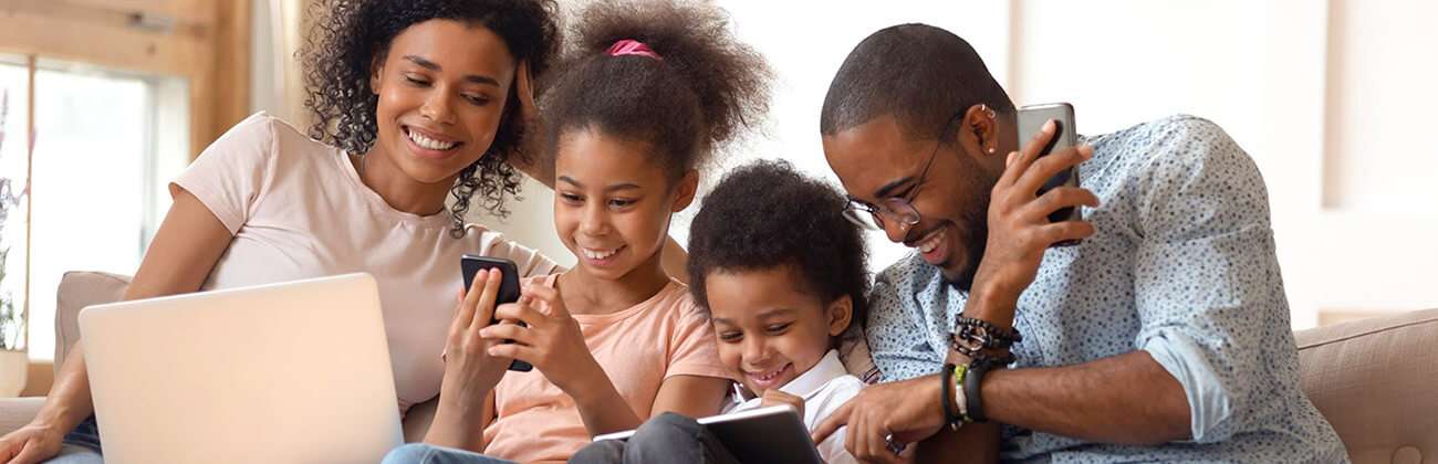Family using mobile devices together
