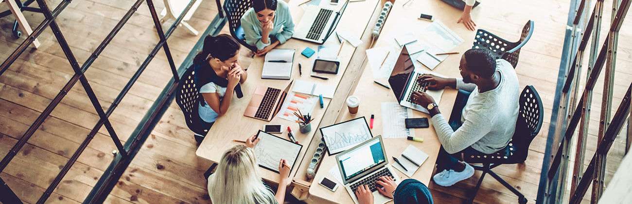 High angle view of an office space with many devices networking together