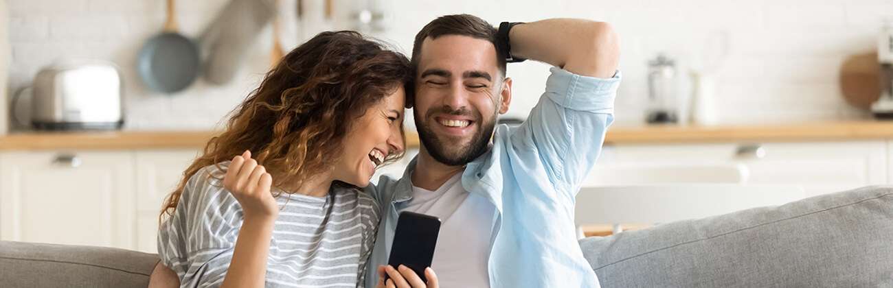 Young couple celebrates newly activated phone
