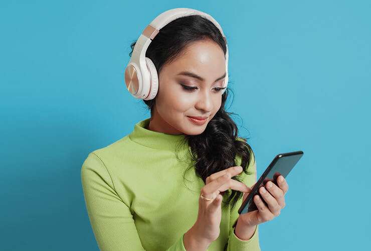 Woman in headphones on phone