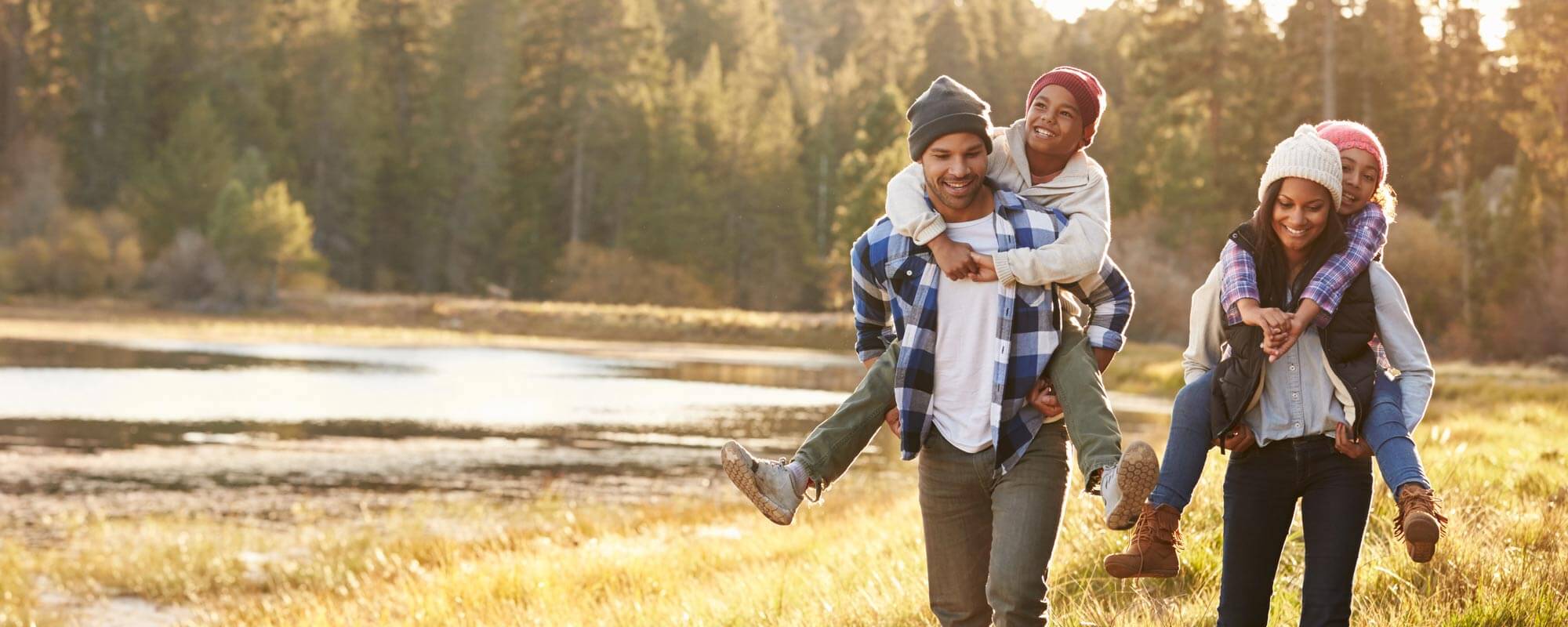 Family out hiking in fall sunlight