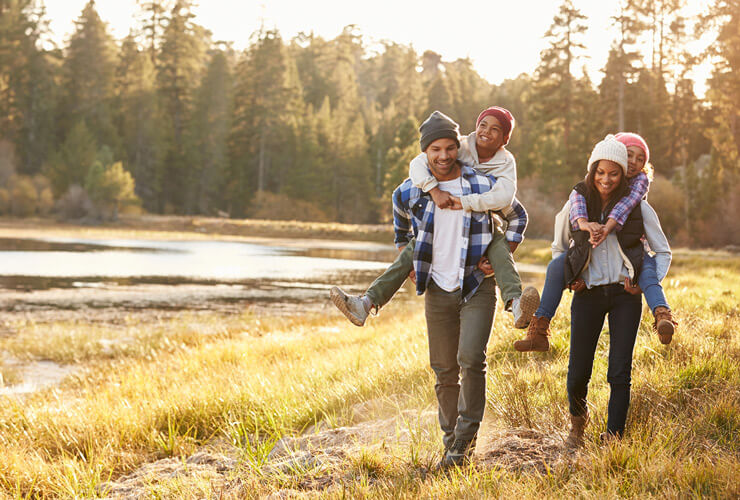 Family out hiking in fall sunlight