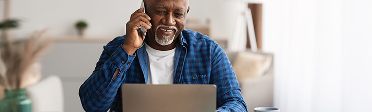 African American man on mobile identifies IMEI number