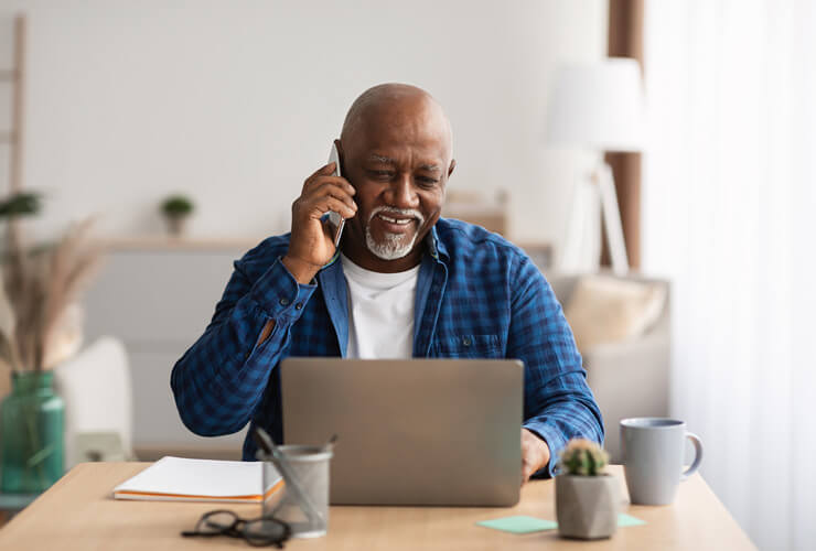 African American man on mobile identifies IMEI number