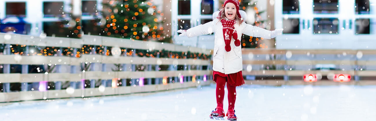 Holiday activity guide - girl in festive winter attire skates in an outdoor rink