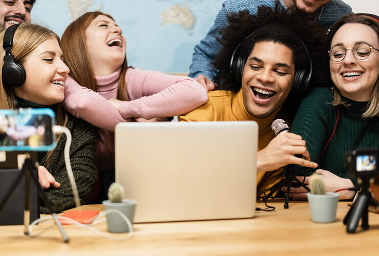 Diverse group of young adults live streaming a podcast - fiber vs 5G