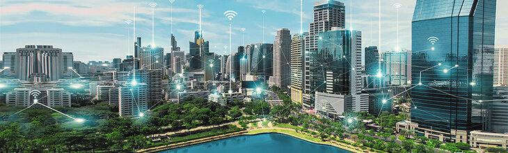 5g network graphically represented over an urban cityscape.