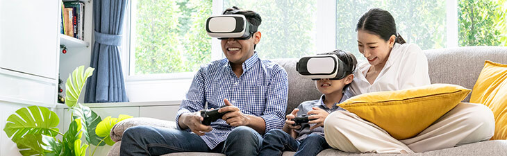 Asian family playing VR games