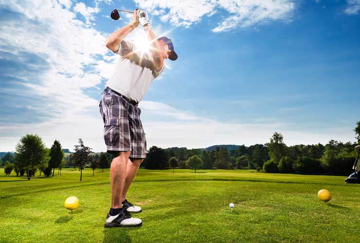 Golfer swinging