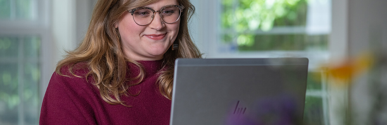 woman at laptop tests internet speed