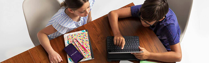 children doing their homework on their tablets