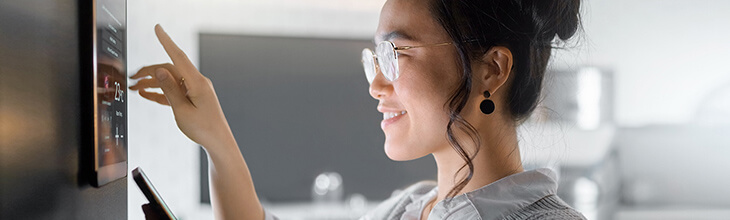 Woman setting up whole home system