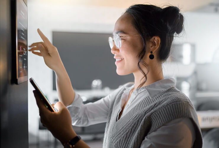 Woman setting up whole home system