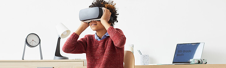 middle school boy playing with VR