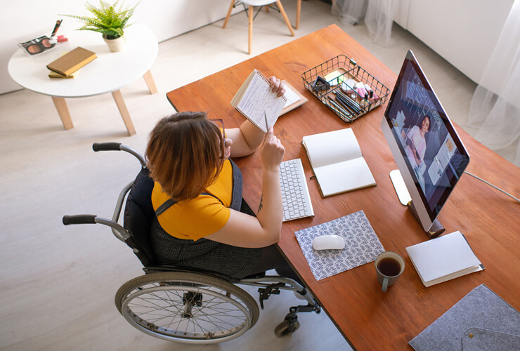 Woman teleconferencing from her home office
