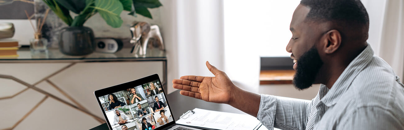 Man works from home on a teleconference call